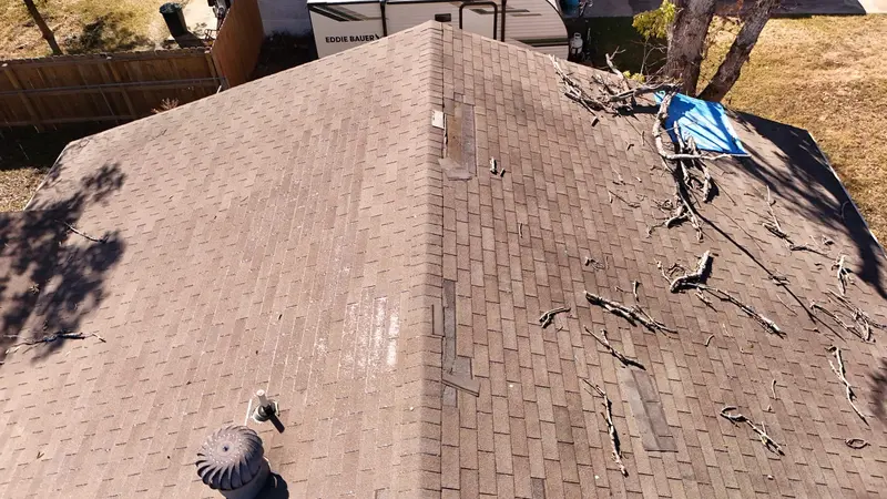 An ARP emergency tarp holding back the weather on a Corpus Christi roof while the permanent repair is scoped and photographed.