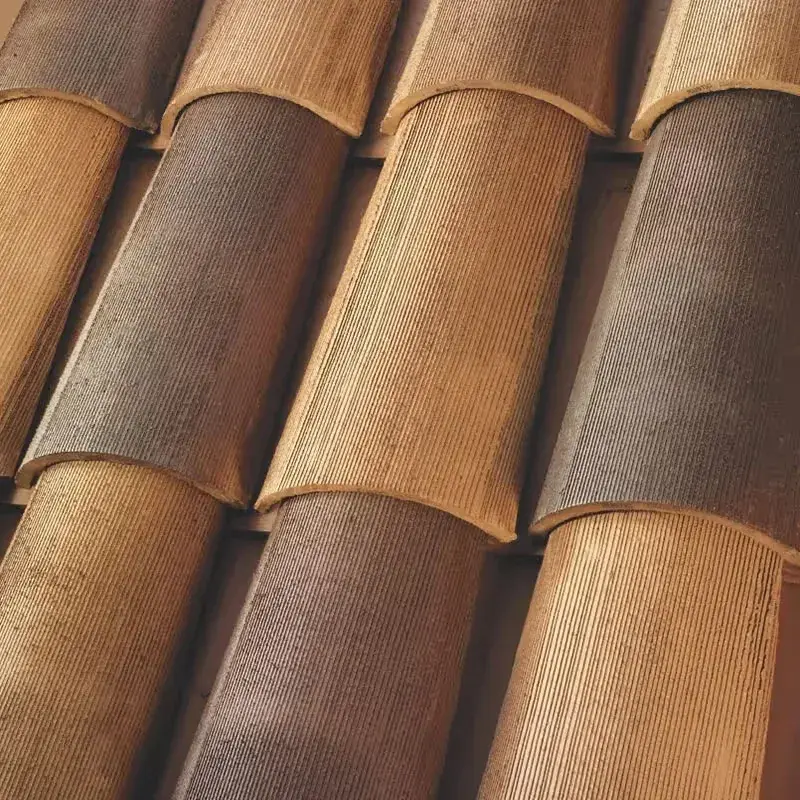 Close detail of a clay barrel-tile roof showing the overlapping S-shaped tiles