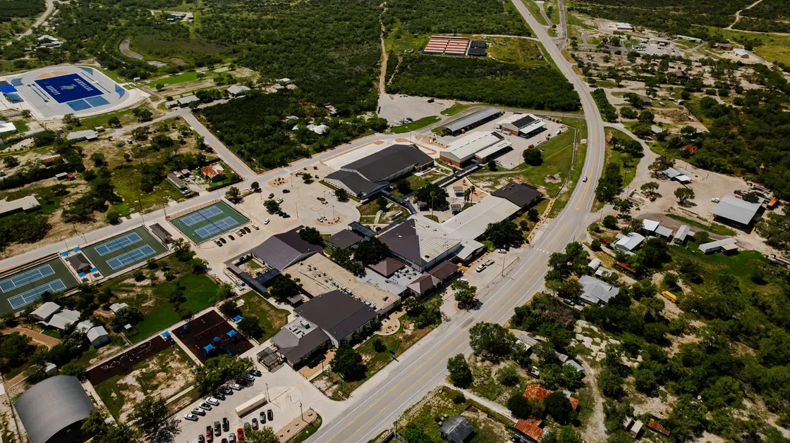 Aerial view of a commercial campus with dark single-ply membrane flat roofs