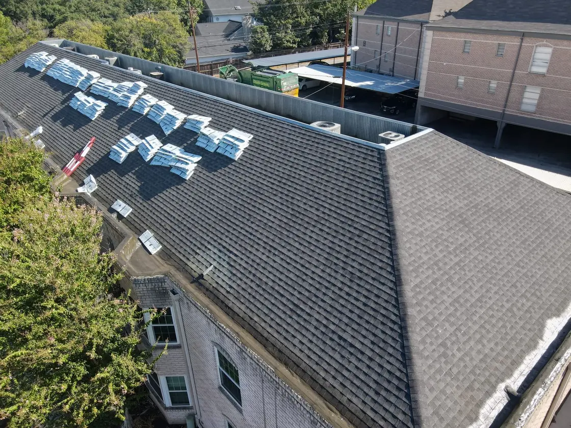 Rooftop HVAC units and curbs on a commercial flat roof