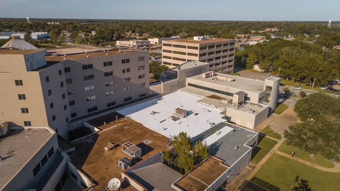 Aerial view of a commercial single-ply membrane flat roof