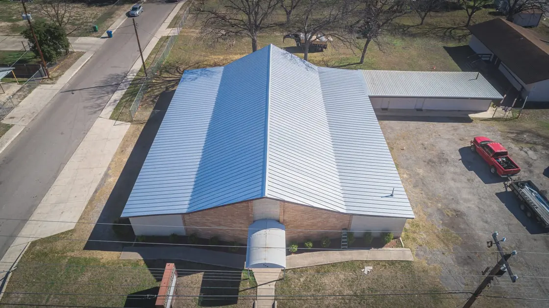 Site-formed standing seam metal roof on a Texas commercial building