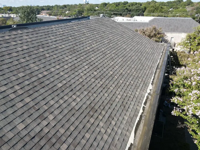 A site-formed standing-seam metal roof on an Austin commercial building — concealed fasteners and long panel runs built for Central Texas hail and wind.
