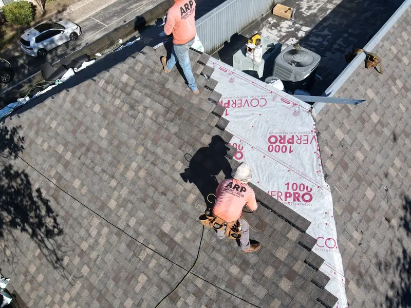 An ARP crew heat-welding TPO seams on a San Antonio commercial roof — a continuous, watertight membrane.