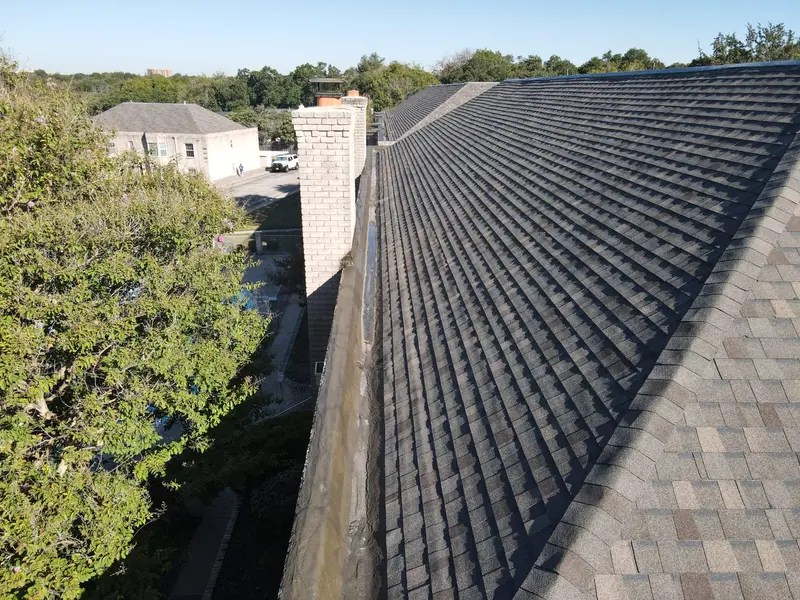 A finished architectural-shingle reroof — clean lines, tight flashing at every transition.