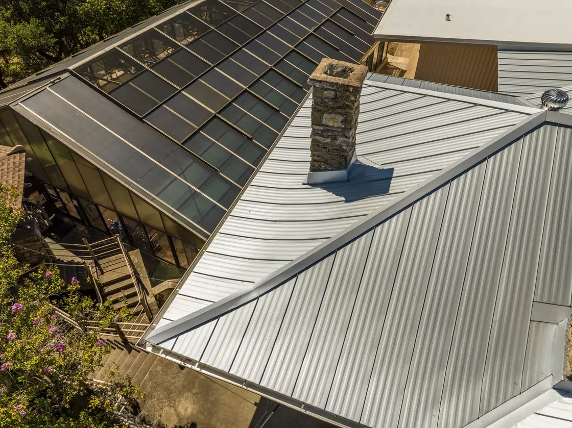 Close-up of chimney flashing on a standing seam metal roof