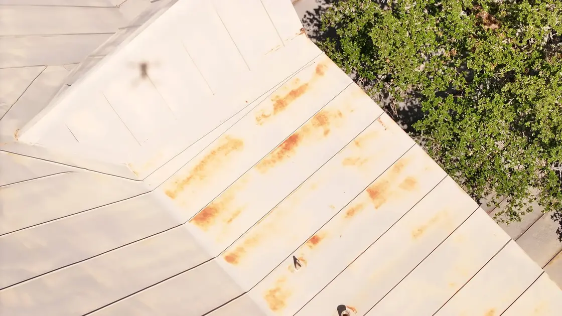 Exposed roof decking showing water staining revealed after the old roof was torn off