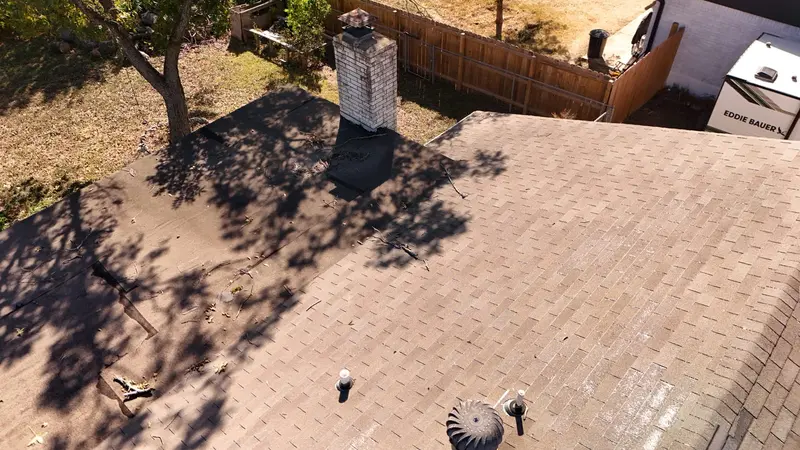 Flashing checked at the chimney — where most roofs leak first, documented in the report you keep.