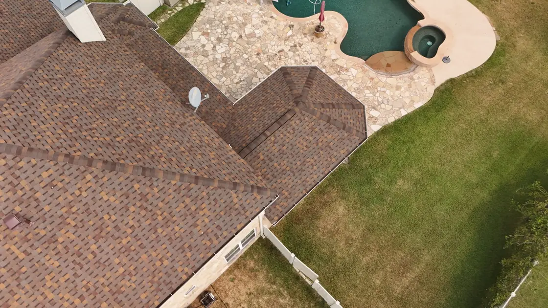 A Texas home with a covered patio, the kind of low-slope section that needs a sealed flat-roof membrane