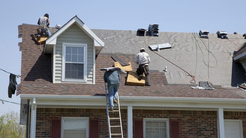 roofers replacing a roof in San Antonio, TX